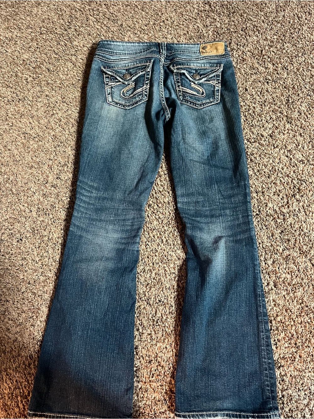 Silver Jeans medium blue flare jeans with embroidered pockets